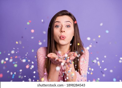 Photo Of Young Beautiful Girl Pouted Lips Blow Confetti You Magic Celebration Isolated Over Violet Color Background