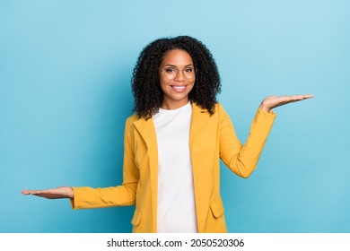 Photo of young black woman happy positive smile measure pros cons proposition advert isolated over blue color background - Shutterstock ID 2050520306