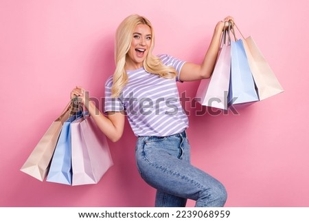 Photo of young blonde hair shopaholic lady addicted hold baggage from boutique overjoyed like cheap clothes price isolated on pink color background