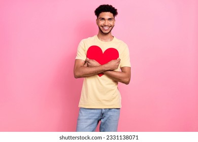 Photo young boyfriend guy hold close to chest embrace big red paper heart wear shirt jeans isolated pink color background - Shutterstock ID 2331138071