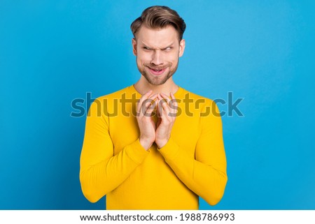 Photo of young brown hair man tricky cunning have idea look empty space isolated over blue color background