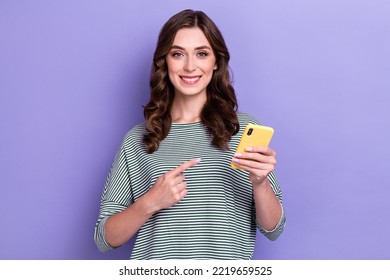 Photo Of Young Business Lady Hold New Apple Iphone New Version Advertisement Customer Low Price Finger Point Isolated On Purple Color Background