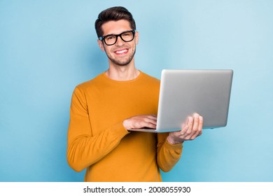 Photo of young business man happy positive smile use laptop work programmer isolated over blue color background - Shutterstock ID 2008055930