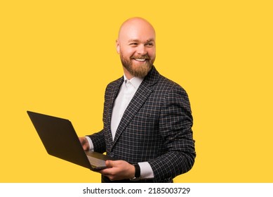 A Photo Of A Young Businessman Holding A Brand New Laptop While Smiling At The Camera