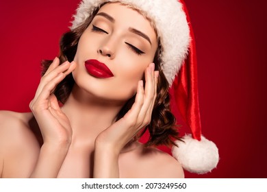 Photo Of Young Charming Lady Apply Make Up Face Lip Gloss Christmas Spirit Isolated On Maroon Gradient Background