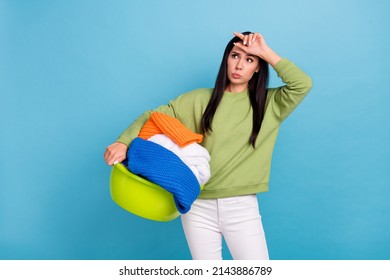 Photo Of Young Charming Wife Tired Of Everyday Chores Don't Want To Do Laundry Isolated On Blue Color Background