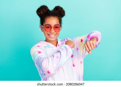 Photo Of Young Cheerful Afro Girl Have Fun Dancer Sleepover Eyewear Isolated Over Turquoise Color Background