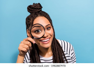 Photo of young cheerful black girl look watch loupe enlarge detective interested isolated over blue color background - Shutterstock ID 1982887970