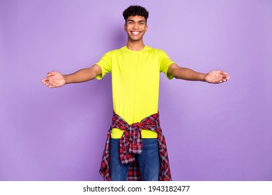 Photo of young cheerful black guy happy positive smile open arms welcome hug isolated over purple color background
