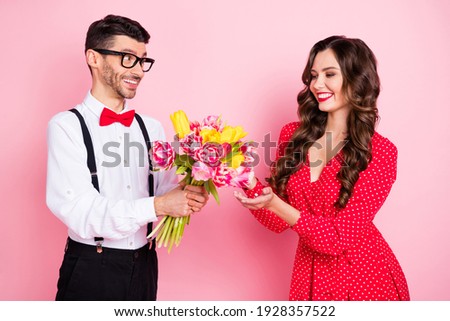 Photo of young cheerful couple happy smile guy present flower bouquet romantic valentine day isolated over pastel color background