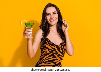 Photo Of Young Cheerful Girl Have Fun Drink Alcohol Festive Christmas Holiday Isolated Over Yellow Color Background