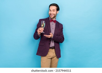 Photo Of Young Cheerful Guy Present Wine Promo Recommend Waiter Suggest Isolated Over Blue Color Background