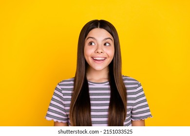 Photo Of Young Cheerful Lovely Girl Curious Look Empty Space Plan Isolated Over Yellow Color Background