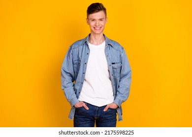 Photo of young cheerful man confident hands in pocket wear casual outfit isolated over yellow color background - Shutterstock ID 2175598225