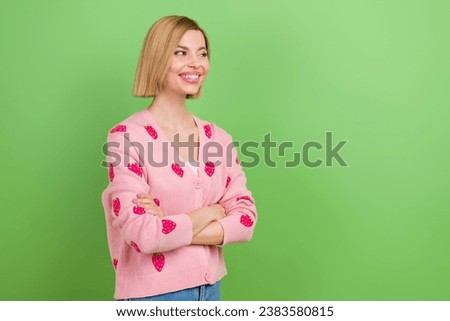 Photo of young cheerful smiling thoughtful pretty woman folded hands look novelty minded watching isolated on green color background