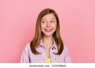 Photo Of Young Cheerful Teen Girl Wonder Look Empty Space Dreamy Minded Isolated Over Pink Color Background