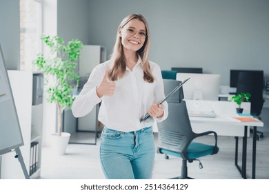 Photo of young corporate woman clipboard thumb up modern office business center indoors - Powered by Shutterstock