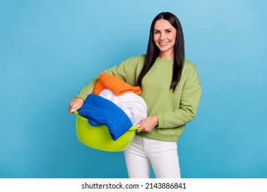 Photo Of Young Cute Positive Housewife Cleaning Home Doing Laundry Wash Dirty Clothes Isolated On Blue Color Background