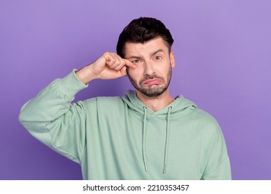 Photo Of Young Depressed Businessman Wear Khaki Hoodie Wipe Nervous Bad Mood Problems Company Work No Profit Isolated On Violet Color Background