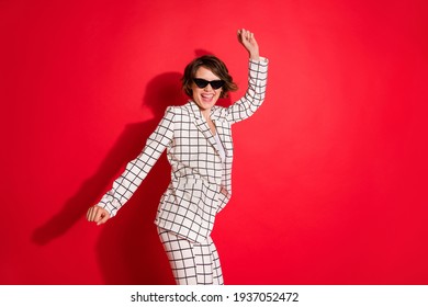 Photo Of Young Excited Crazy Girl Happy Positive Smile Have Fun Enjoy Music Dance Party Isolated Over Red Color Background