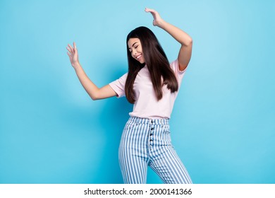 Photo of young excited girl happy positive smile enjoy music dance party isolated over blue color background - Shutterstock ID 2000141366