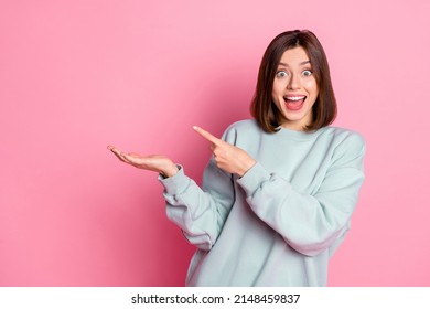 Photo Of Young Excited Girl Indicate Finger Product Offer Discount Select Isolated Over Pink Color Background