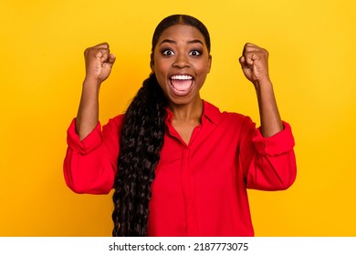 Photo of young excited girl rejoice luck ecstatic lottery fists hands triumph isolated over yellow color background - Powered by Shutterstock