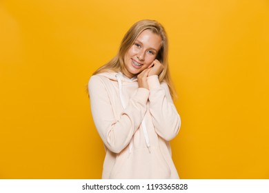 Photo Of Young Female Student Or School Girl With Dental Braces Smiling At Camera Isolated Over Yellow Background