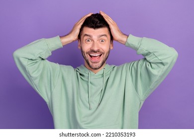 Photo Of Young Funny Excited Millennial Man Bristle Brunet Wear Hoodie Hands Hold Head Open Mouth Crazy Big Sale Shopping Isolated On Violet Color Background