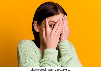 Photo Of Young Girl Cover Face Hands Look Eye Spy Scared Frightened Isolated Over Yellow Color Background.