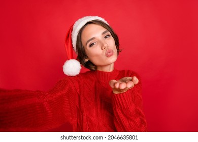 Photo of young girl happy positive smile send air kiss you flirty make selfie isolated over red color background - Powered by Shutterstock