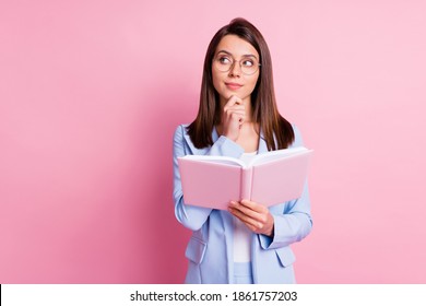 Photo of young girl hold notebook book dreamy think thoughtful look empty space isolated over pastel color background - Powered by Shutterstock