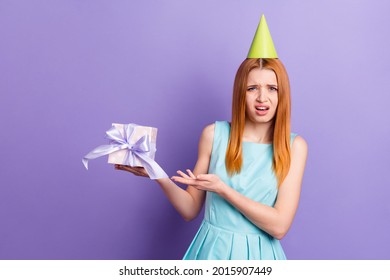 Photo Of Young Girl Unhappy Dislike Hold Present Box Birthday Party Isolated Over Purple Color Background