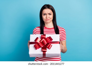 Photo Of Young Girl Unhappy Sad Upset Negative Dislike Surprise Present Box Isolated Over Blue Color Background