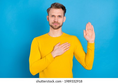 Photo Of Young Guy Serious Confident Hand On Chest Make Oath Promise Isolated Over Blue Color Background