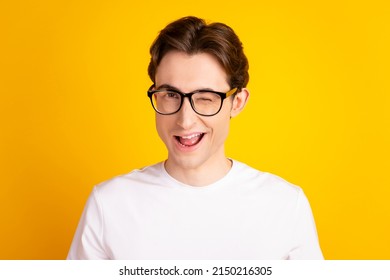 Photo Of Young Handsome Man Good Mood Wink Eye Flirty Date Wear Casual Clothes Isolated Over Yellow Color Background