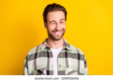 Photo Of Young Handsome Man Happy Positive Smile Wink Eye Flirty Isolated Over Yellow Color Background