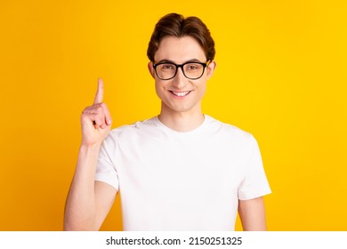 Photo Of Young Handsome Man Point Finger Idea Plan Clever Solution Decision Isolated Over Yellow Color Background