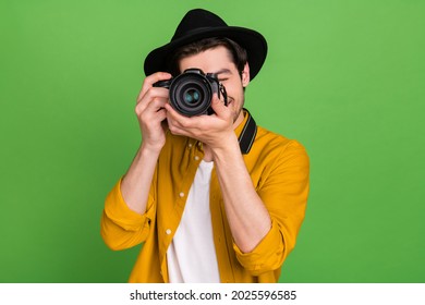 Photo Of Young Handsome Professional Photographer Take Picture You Camera Isolated On Green Color Background