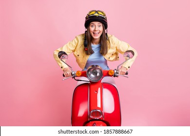 Photo of young happy excited beautiful girl woman ride red motorbike fast wear yellow helmet isolated on pink color background - Powered by Shutterstock