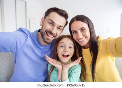 Photo Of Young Happy Family Small Girl Mother Father Take Selfie Together Smile Good Mood Inside Home Living-room