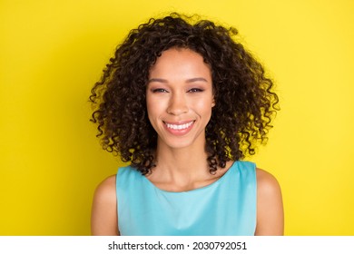 Photo of young happy positive dark skin woman beaming smile good mood cheerful isolated on yellow color background