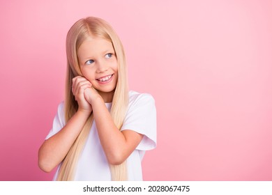 Photo of young happy positive dreamy little girl look empty space imagine idea isolated on pink color background - Shutterstock ID 2028067475