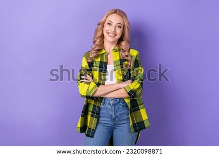 Photo of young hr manager blonde wavy hair folded arms cheerful good mood wear stylish plaid jacket isolated on violet color background
