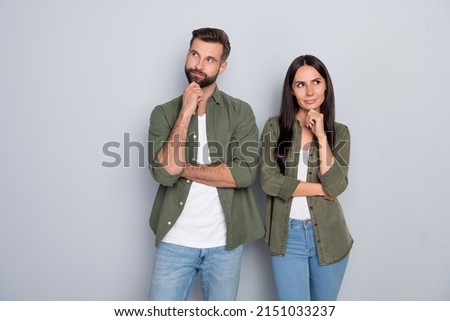 Photo of young husband wife think plan minded look empty space wonder trust isolated over grey color background