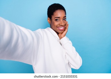 Photo Of Young Lady Guy Shooting Selfie Video Recording Influencer Hand Touch Cheeks Isolated Over Blue Color Background