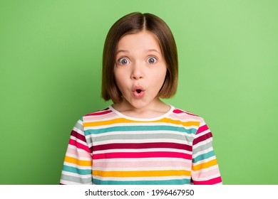 Photo Of Young Little Girl Amazed Shock Surprised Fake Novelty News Omg Wow Reaction Isolated Over Green Color Background