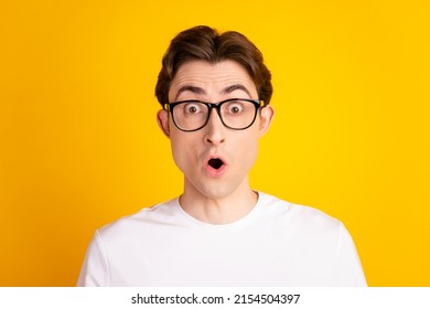 Photo of young man amazed shock omg wow impressed astonished fake information isolated over yellow color background - Shutterstock ID 2154504397