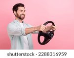 Photo of young man brunet hair driver business assistant hold steering wheel wear shirt kia rio advert isolated on pink color background