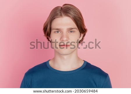Photo of young man in casual clothes confident happy positive smile stands on the background of pink wall